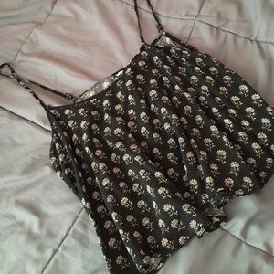 black and cream tank top with flowers on it