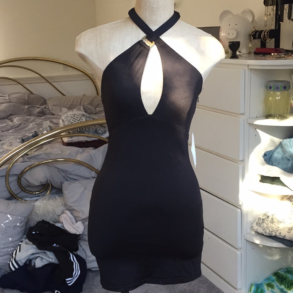 Tobi halter style dress with lining. Stretchy.