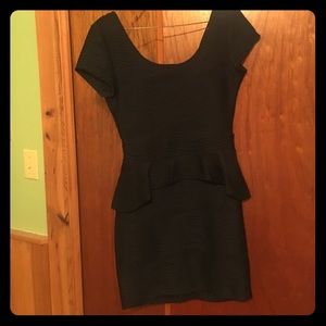 Black form fitting dress with ruffle waist