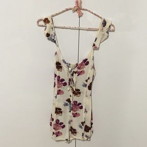 Floral romper with flutter sleeves