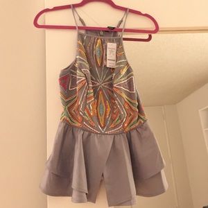 Beaded ruffle peplum top