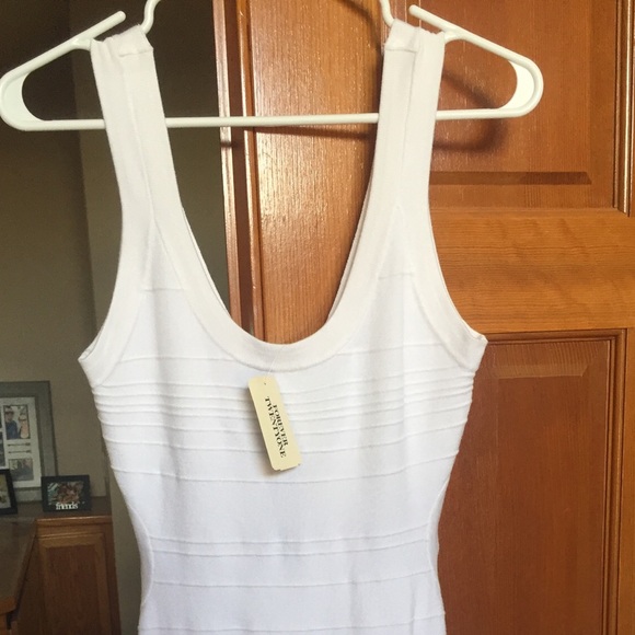 White dress fitted with sexy side cut out design