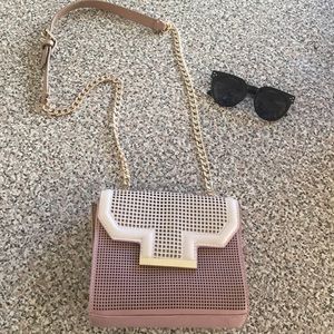 Perforated nude cross body bag