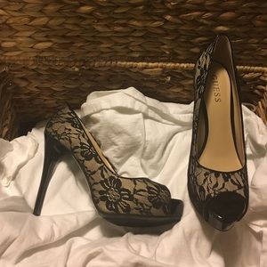 Guess black lace over nude color high heels.