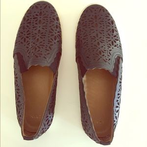 Aerin brand black lazer cut slip-ons.