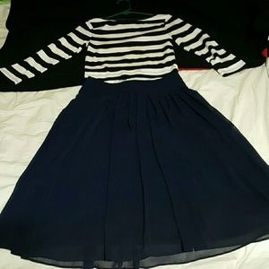 Skirt and stripes blouse.