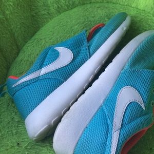 Baby blue and white Nikes Pink on the inside. $40