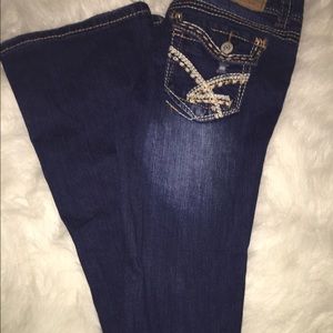 Distressed denim jeans