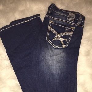 Distressed boot cut jeans