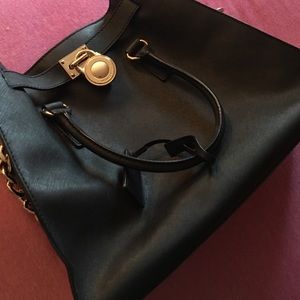 Black and Gold Michael Kors Purse used once.