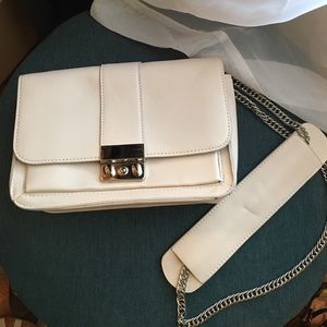 Cream Forever 21 bag with metal chain.