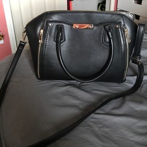 Black purse with crossbody strap