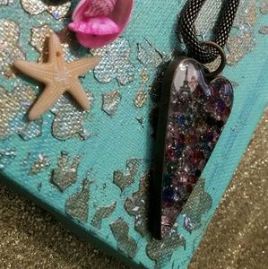 Heart shaped resin pendant with Swarovski crystals