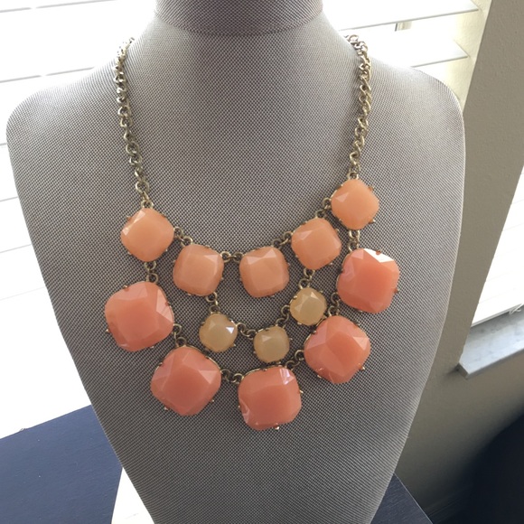 Peach necklace on a gold chain