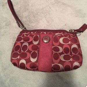 Maroon, silver, tan coach wristlet. Never use it