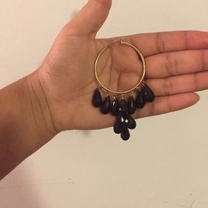 Black and gold hoop chandelier earrings.