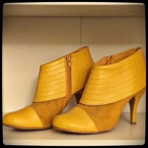Mustard yellow booties by Qupid