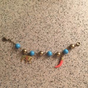 Gold, turquoise, and coral bracelet with 🐘 charm