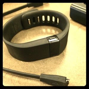 Black FitBit charge. Band size: small
