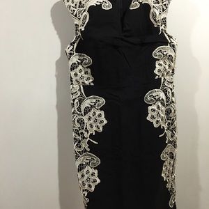 Black dress with lace appliqué