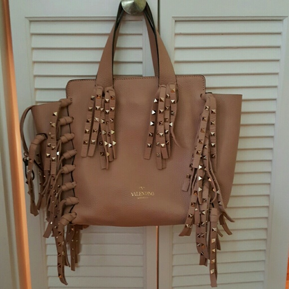 Rockstud rock star fringe leather tote. Beige