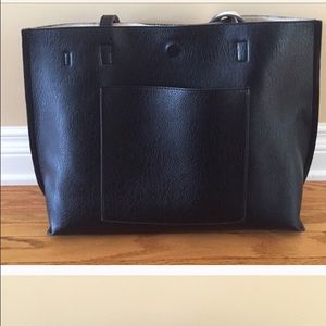 Black and white reversible bag