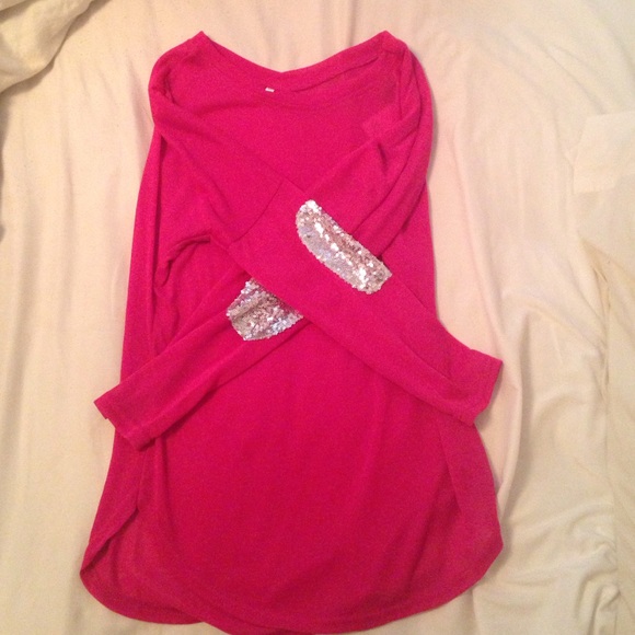 Hot pink shirt with sequins on the elbows