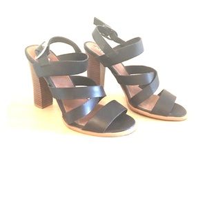 Black strappy heeled sandals.