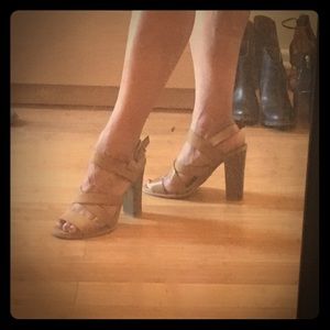 Tan heeled sandals.