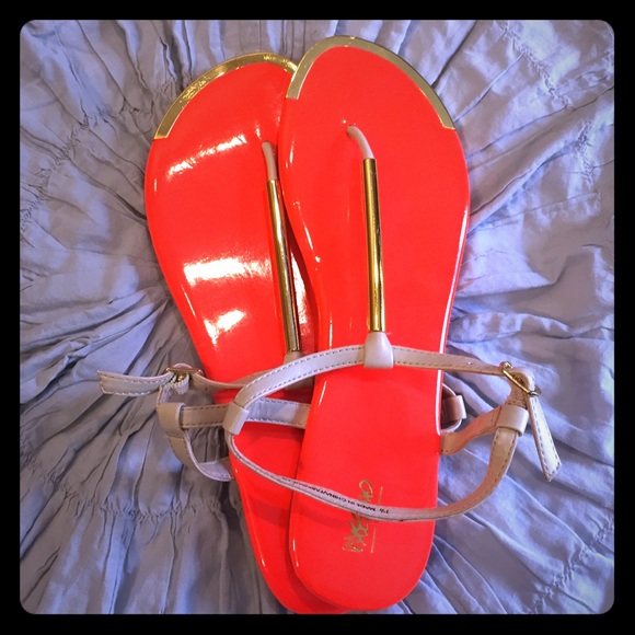 Bright orange wassimo sandles with gold accent