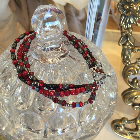 Coral, glass, and hematite bracelet. Red and black