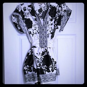 A silky and soft white shirt wth a black design