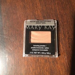 Mary Kay bronzing powder. Medium dark color