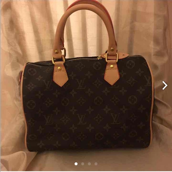 Brown speedy bag . 35. Comes with lock
