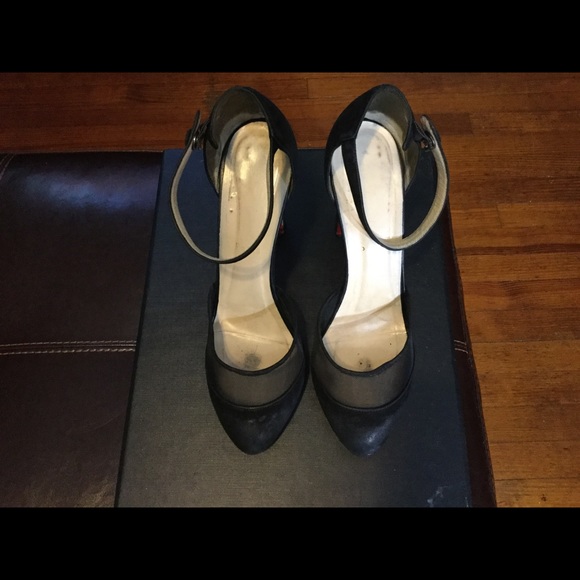 Christian Louboutin's strap heels Barney’s NY.