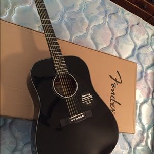 Acoustic black fender guitar