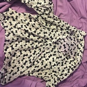 White blouse with black bow design