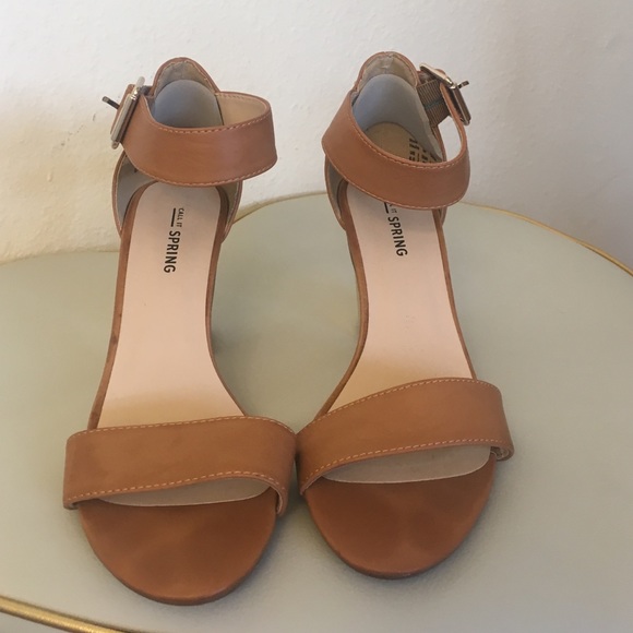 Beautiful tan color sandals with gold heels.