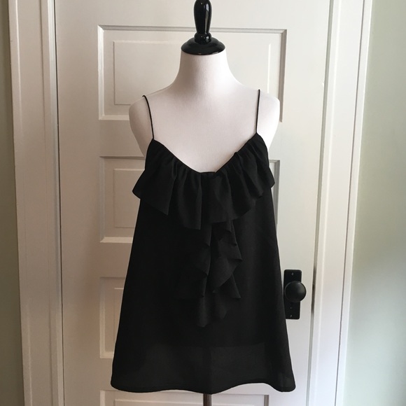 Black camisole with ruffle detail.