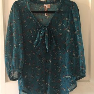 Teal blouse with floral pattern
