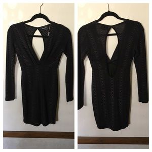 Tight Black mini dress.
