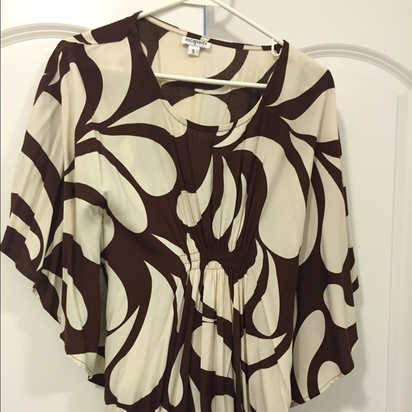 Small boutique piko style shirt.