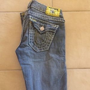 True religion light wash denim jeans.