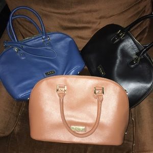 Three Joy and Iman handbags