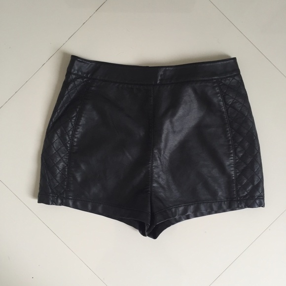 Black faux leather shorts with side detail