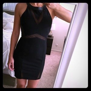 Black bodycon dress with faux leather accents