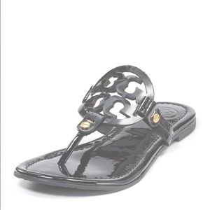 Black Patent leather flip flops by Tory Burch