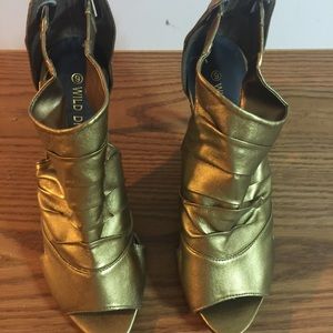 New. Never been worn. Shoes. Heels. Gold. Size 9.