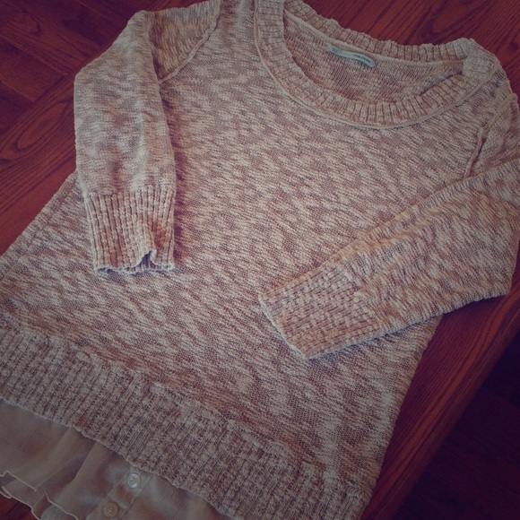 Loose knit sweater with flounce hem