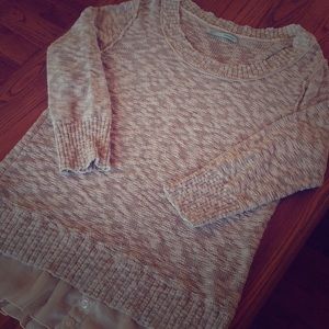 Loose knit sweater with flounce hem